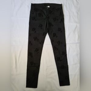 Divided Black Skinny Jeans with Subtle Skull Pattern